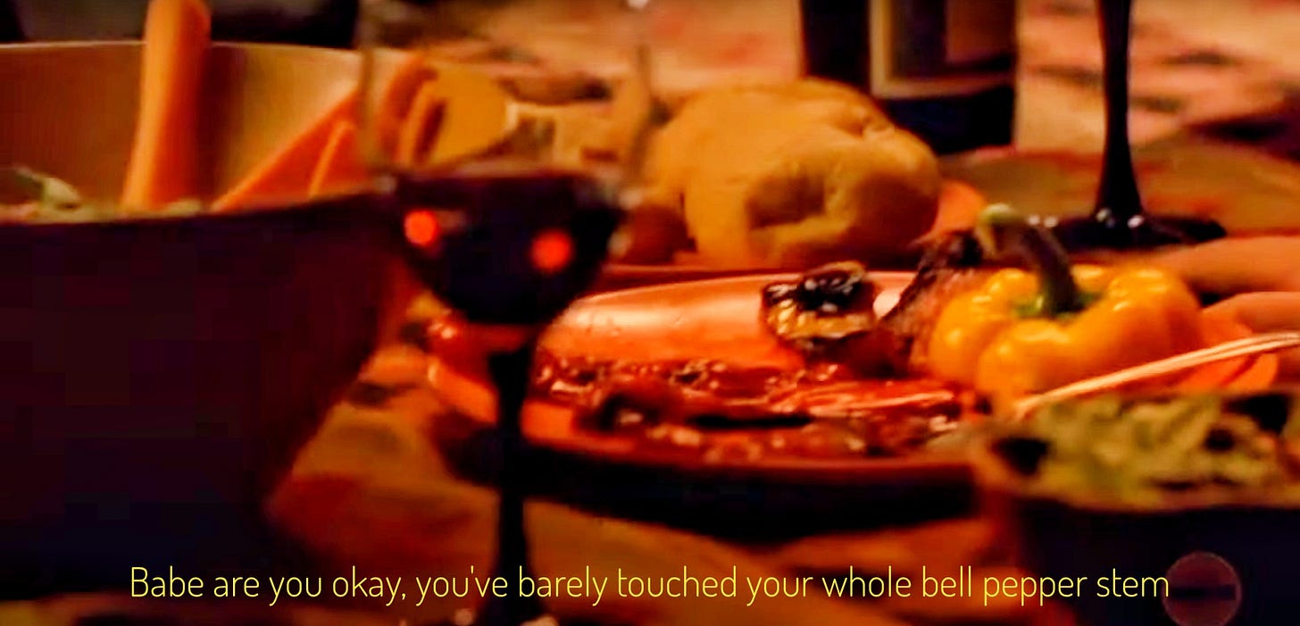 A spread of mostly unidentifiable vegetables and wine, with a whole top of a yellow bell pepper on a plate. Captioned "Babe are you okay, you've barely touched your whole bell pepper stem"