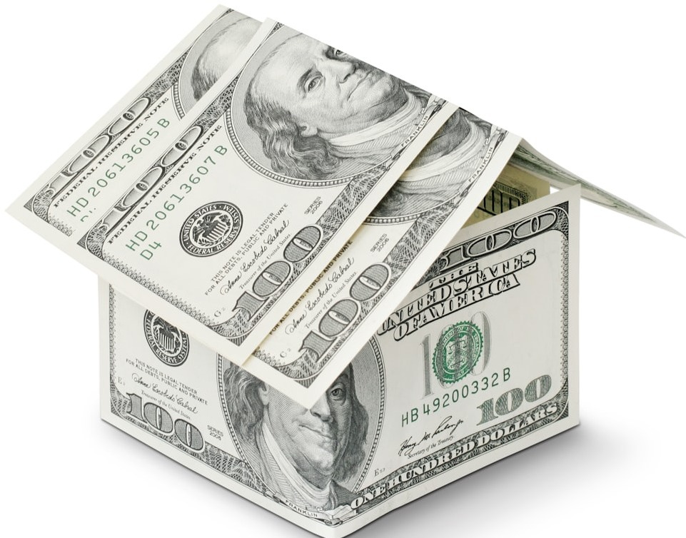 A house made out of money on a white background
