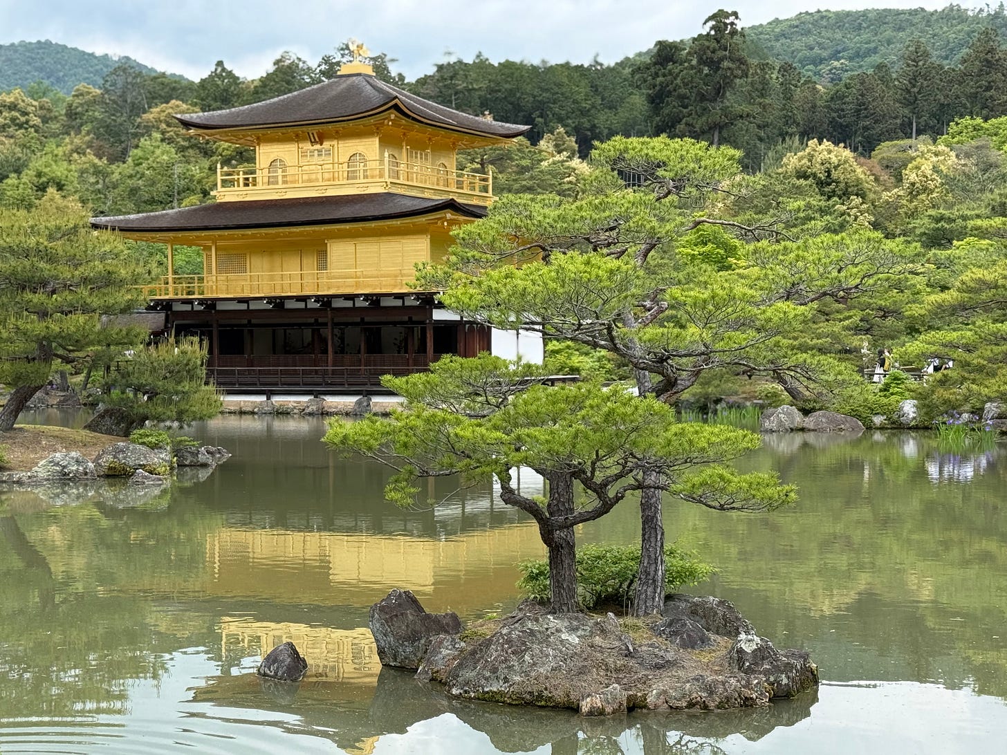 Kinkaku-ji, the Zen Buddhist Golden Temple reflected in still water, Kyoto, Japan Kinkaku-ji, the Zen Buddhist Golden Temple reflected in still water, Kyoto, Japan