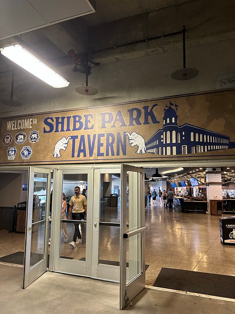 A 3 picture gallery including a large beer held up with the ball game in the background, a person selling snacks in the aisles of the stadium, and the Shibe Park Tavern, a stadium bar at the Oakland Coliseum