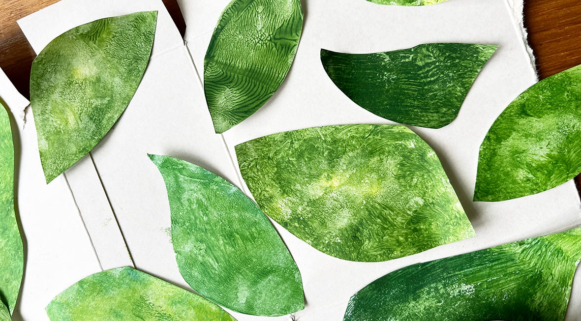 a photo of lots of green painted leaves a photo of lots of green painted leaves