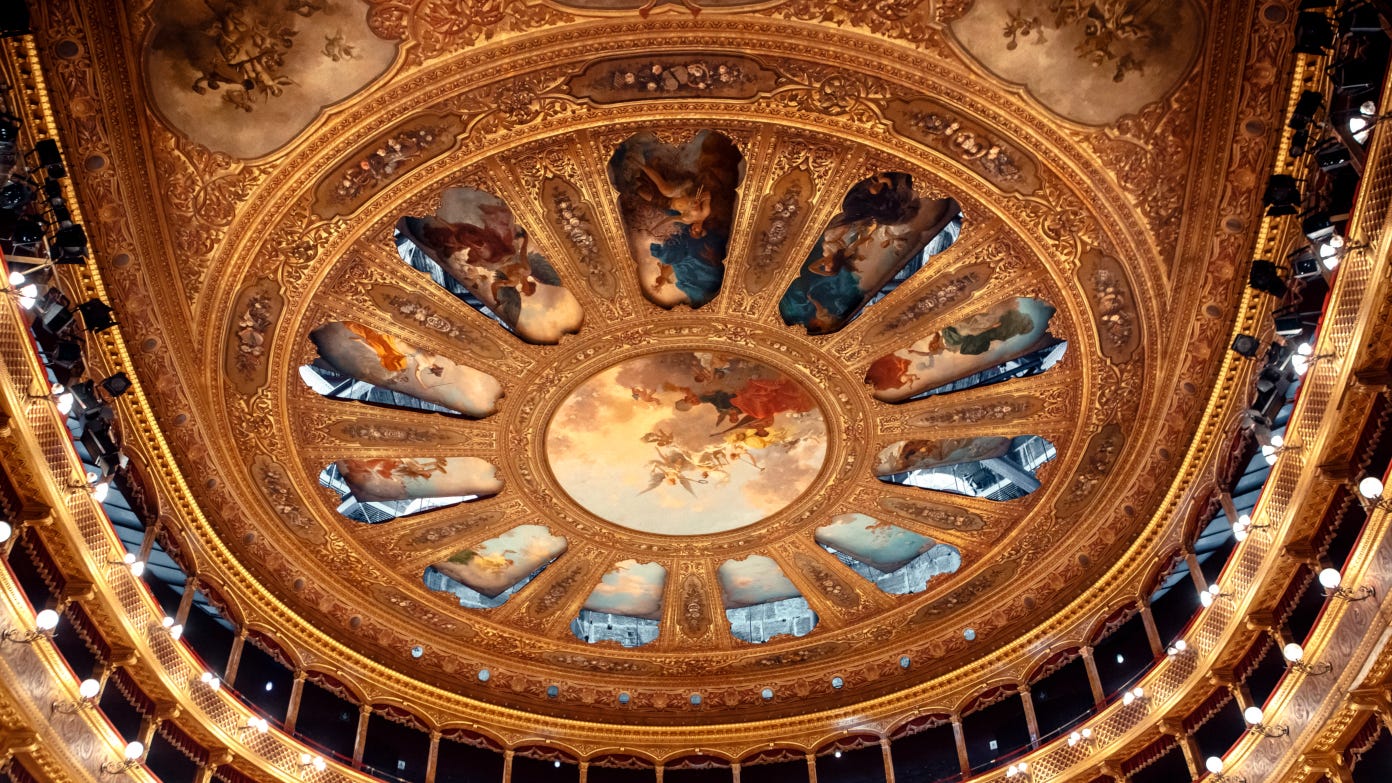 ornate ceiling featuring classical imagery