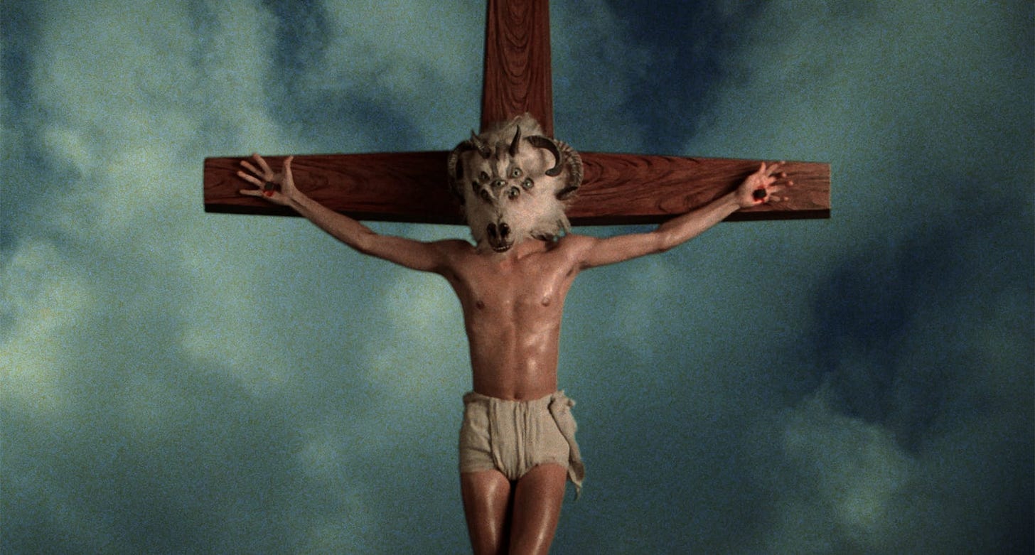 Altered States | Still features a crucifix in the middle of a sky with a bizarre goat-like head with multiple eyes.