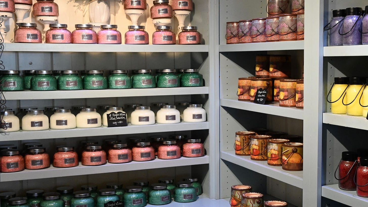 A store shelf with rows and rows of candles.