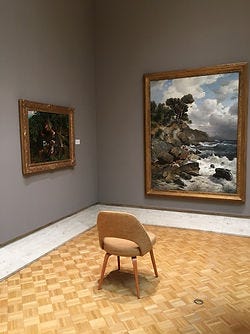 Chair for contemplation of art on wall in Chazen Museum of Art, Madison, Wisconsin