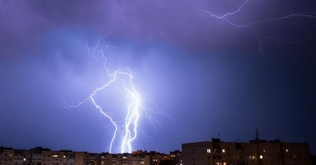 Photo: Danila Popov / Pexels Striking lightning bolt illuminates cityscape during a nighttime thunderstorm.