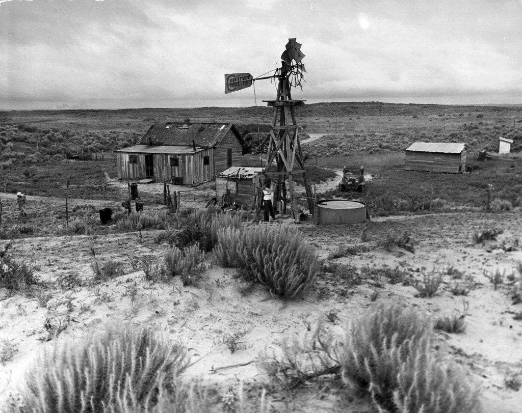 "Sagebush and sand surround [Oklahoma farmer John] Barnett's house and farm buildings. There is no topsoil left on the 160 acres. He grows rye and fodder in sandy loam."