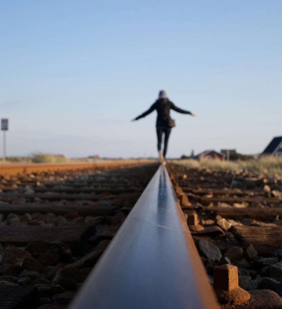 woman walking on train railway woman walking on train railway