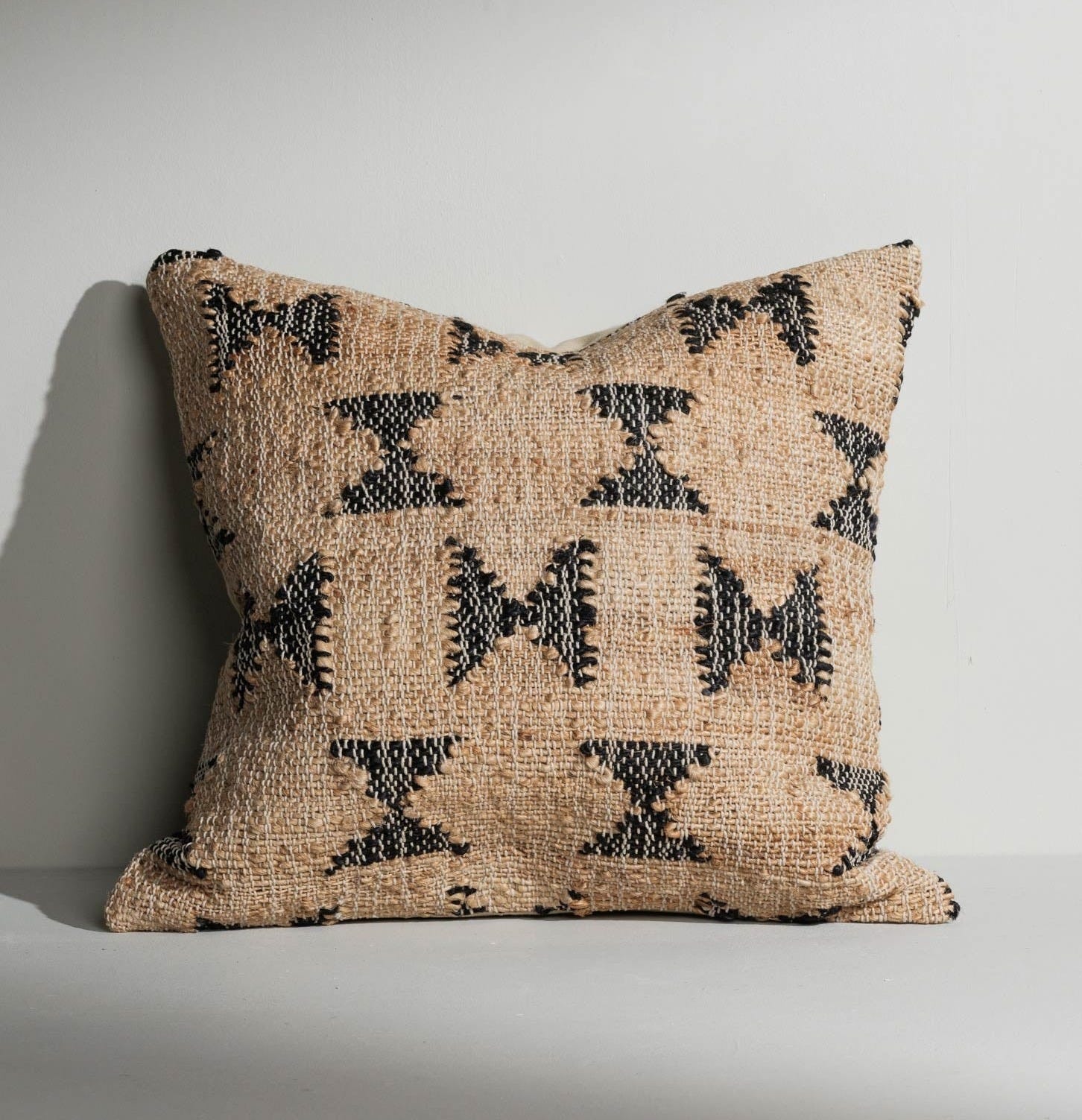 hessain cushion with black shaped pattern