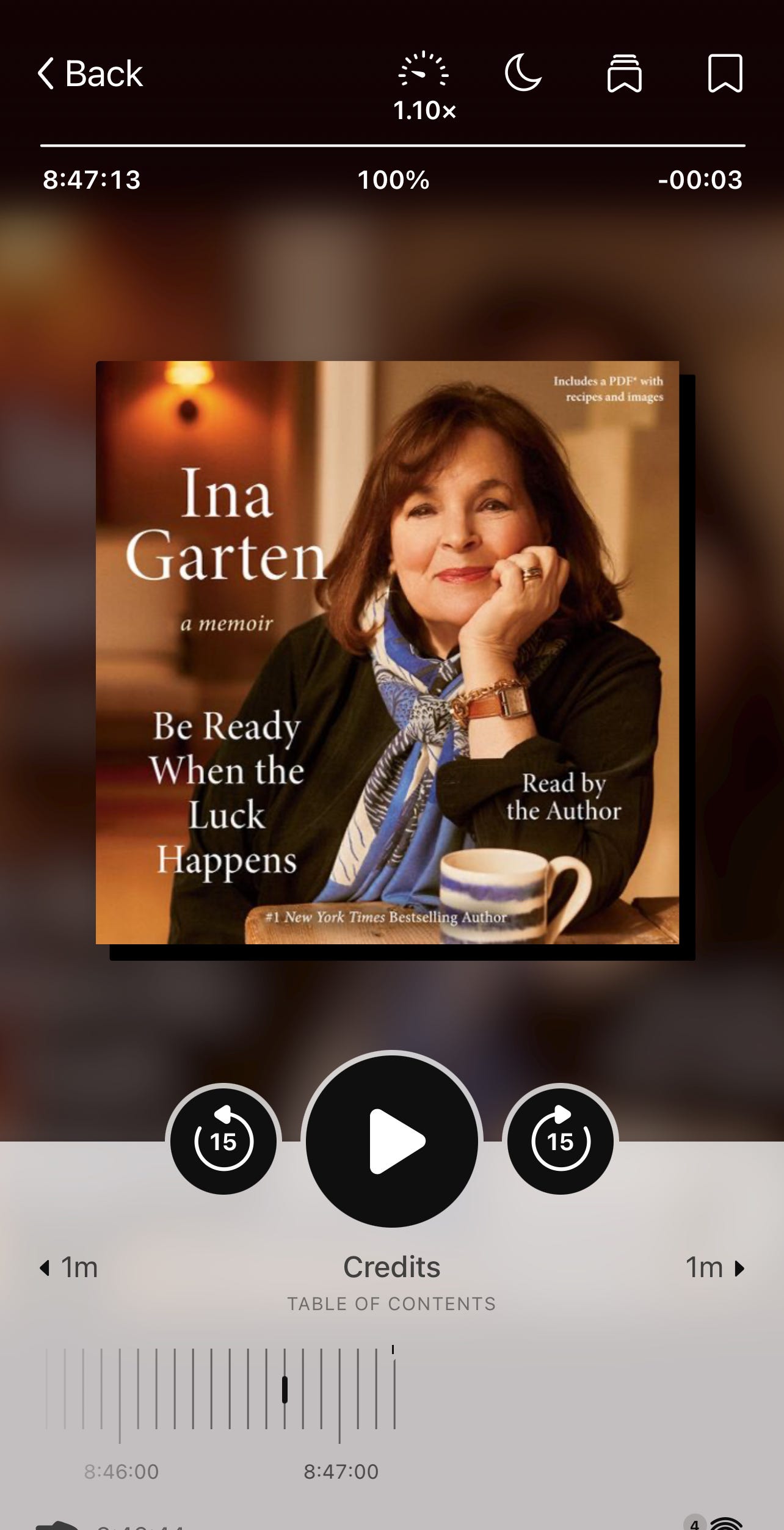 Screenshot of Ina Garten's audiobook 'Be Ready When the Luck Happens: A Memoir' showing the cover with Ina smiling, chin resting on her hand, wearing a black jacket and blue scarf. The audiobook player shows 8 hours 47 minutes total length, currently at 100% completion.