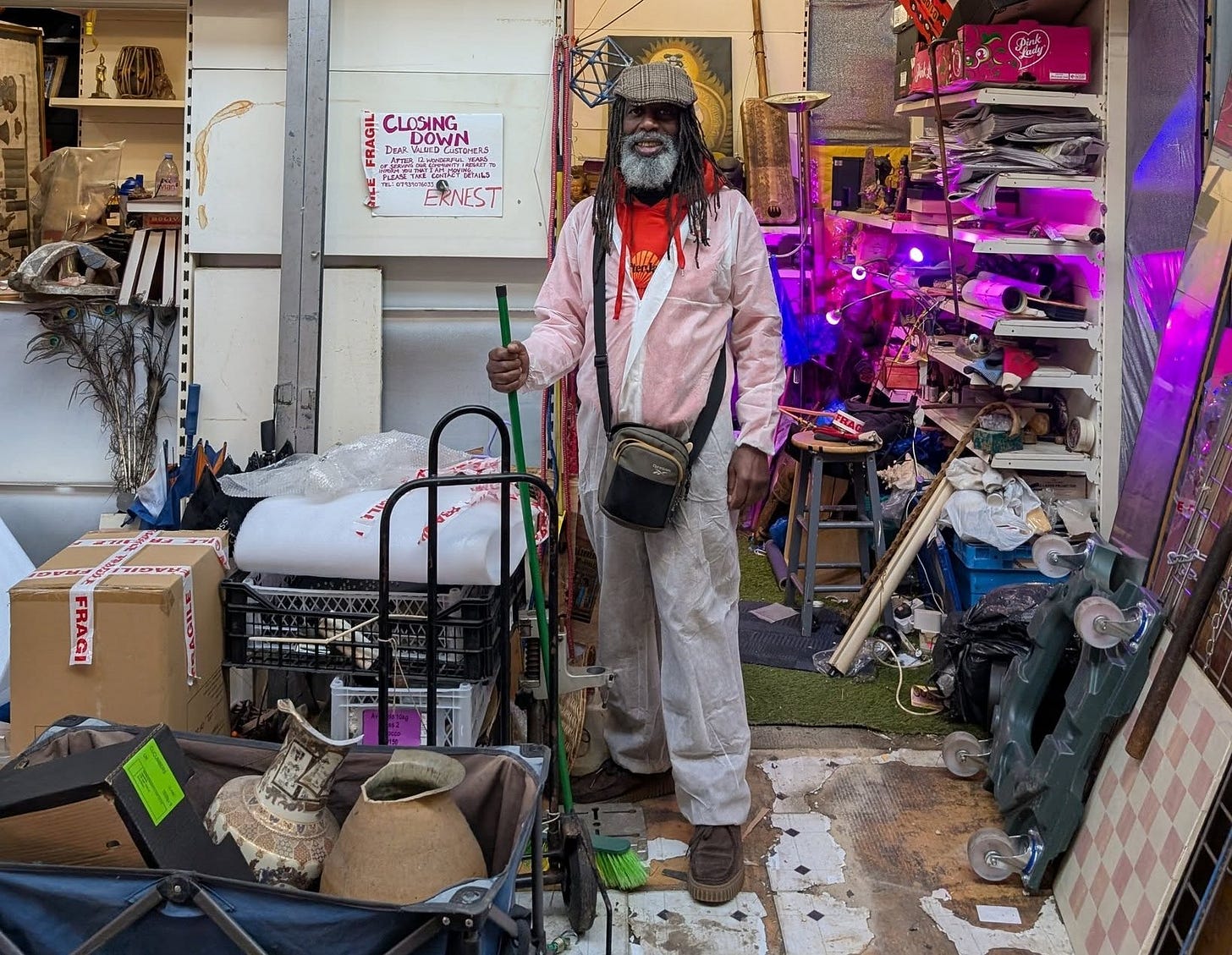 May be an image of 1 person, hat shop and text