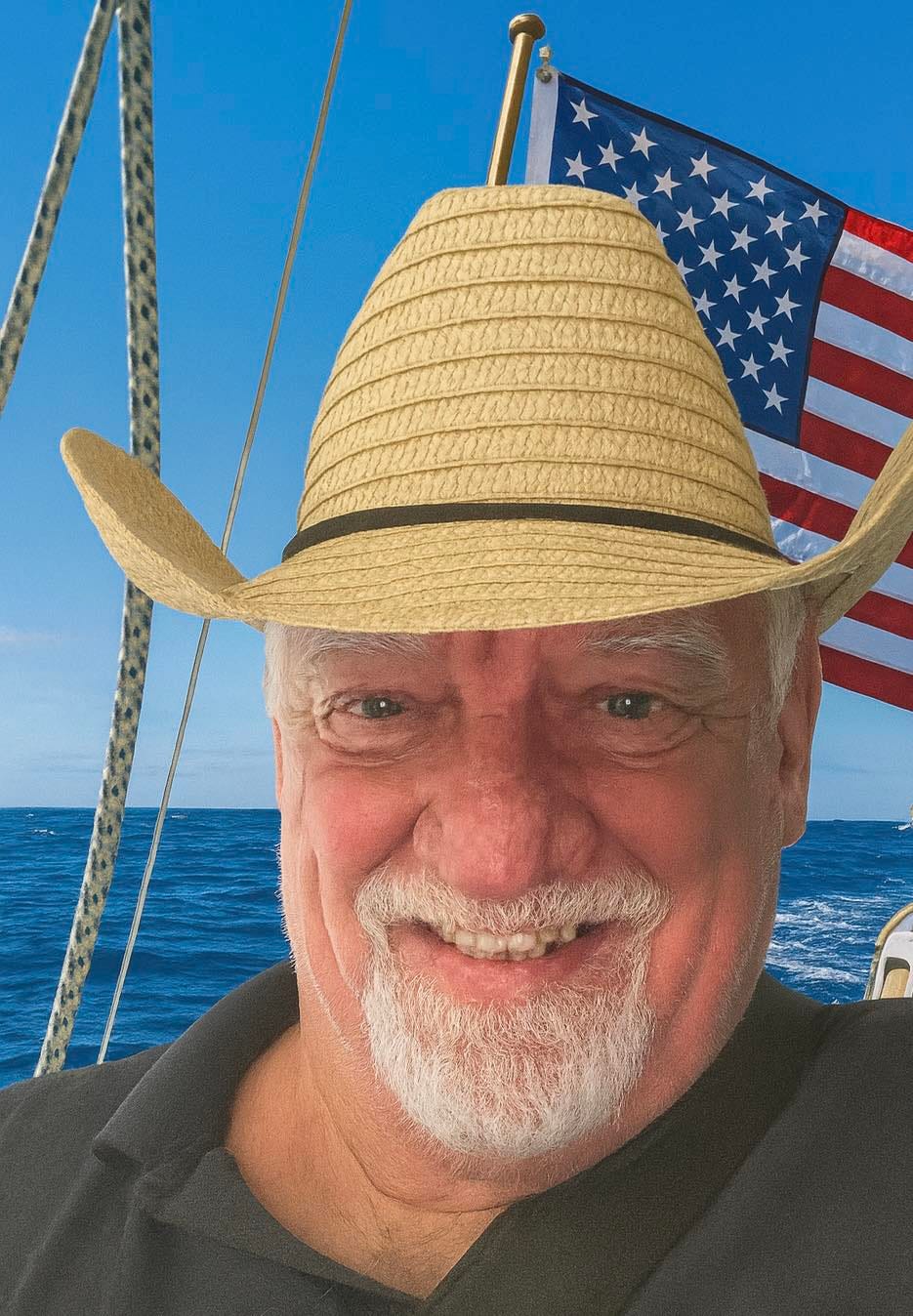 May be an image of one or more people, hat, sail and sailboat