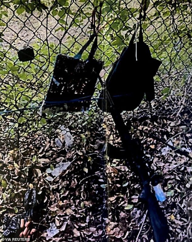 The gunman had an AK-style rifle with a scope, a GoPro camera and two backpacks hanging from a fence. The belongings are being processed