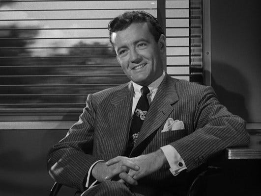 Bruno turns on the charm when making Guy's acquaintance on the train.