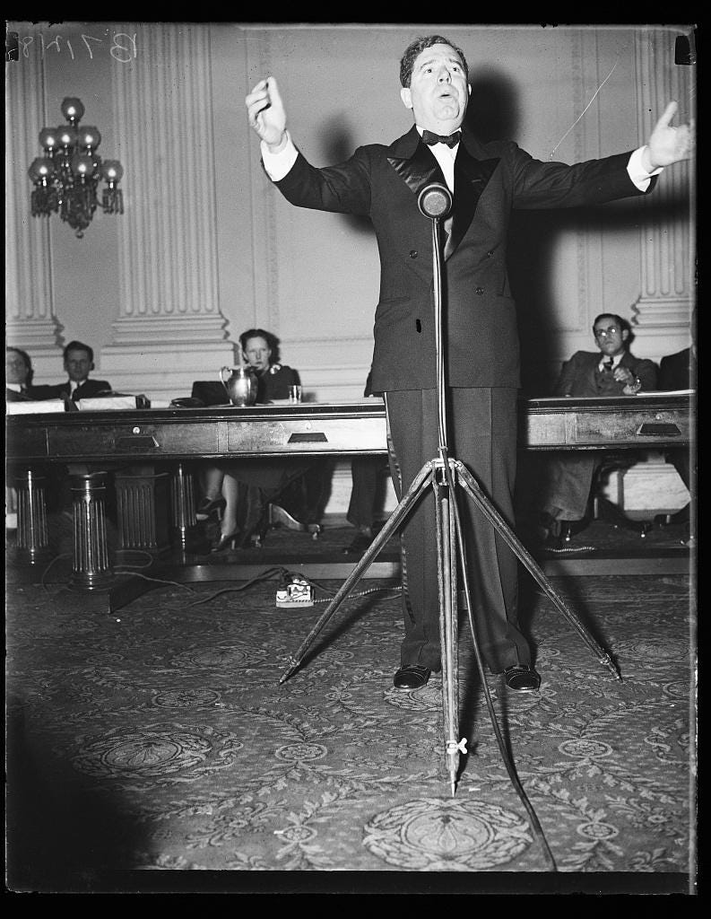Old photo of Huey P. Long giving a speech.