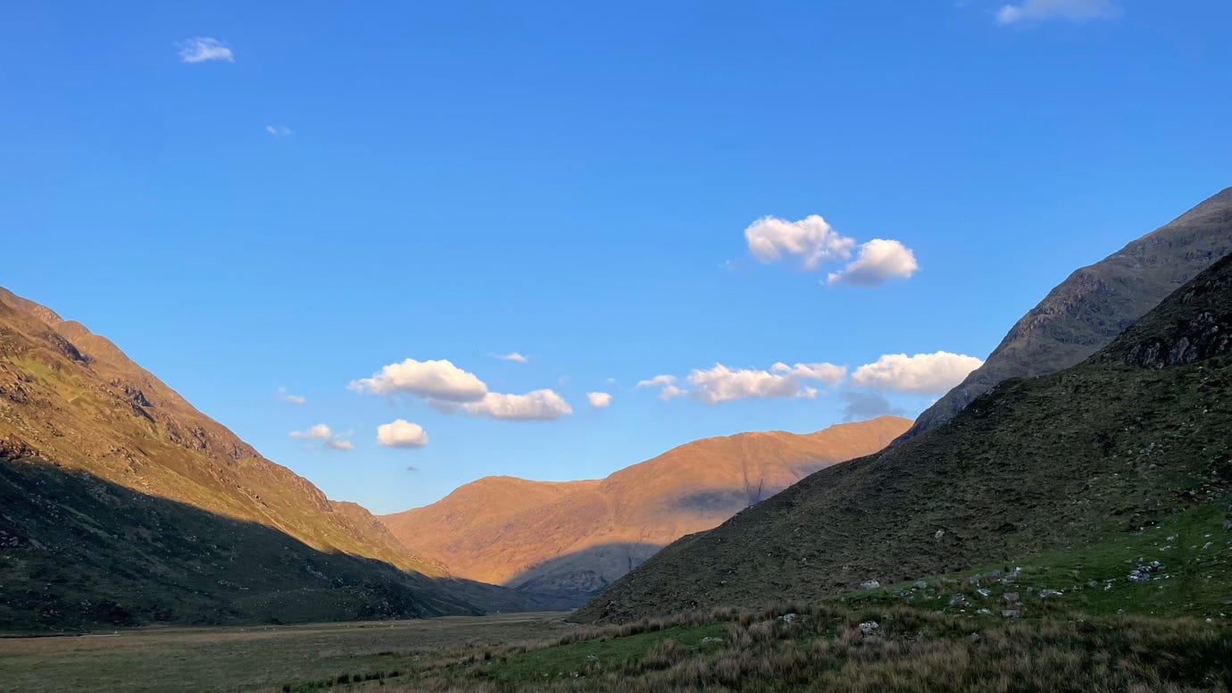 A landscape of mountains and blue sky

AI-generated content may be incorrect.
