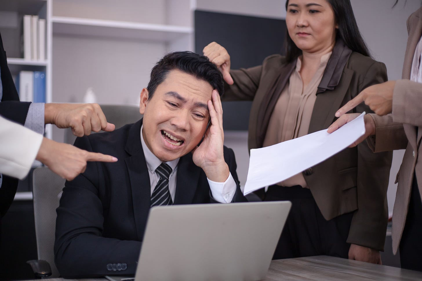man getting yelled at at work with disappointment