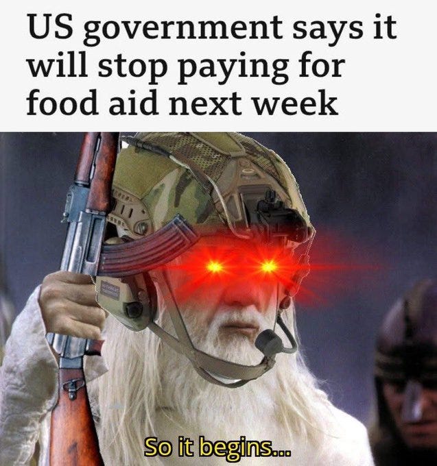 Character resembling Gandalf in tactical helmet and gear holds a rifle with glowing red eyes, stern expression, microphone on gear, overlaid text reads US government says it will stop paying for food aid next week at top and So it begins at bottom.