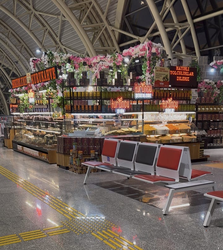 photo of a fruit and nut shop in an airport and a bag of short grain brown rice