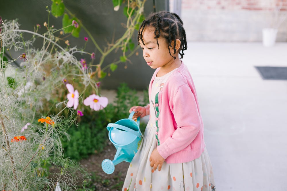 montessori activities for the summer watering plants outdoors