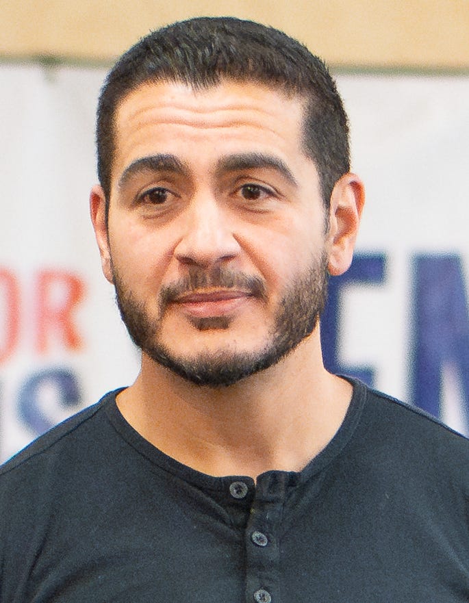 Abdul El-Sayed head shot; short hair, beard, casual button up shirt Abdul El-Sayed head shot; short hair, beard, casual button up shirt