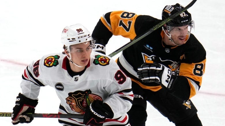 Bedard bests Crosby, picks up assist in 1st NHL game as Chicago earns comeback win | CBC Sports Bedard bests Crosby, picks up assist in 1st NHL game as Chicago earns comeback win | CBC Sports