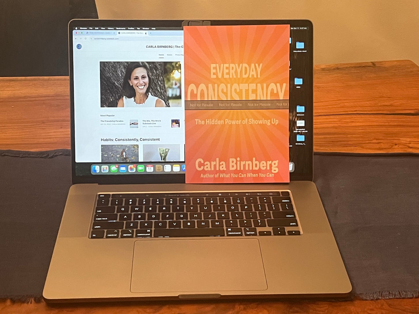Photo by Carla Birnberg featuring her book Everyday Consistency: The Hidden Power of Showing Up displayed in front of her Substack site The Consistency Advantage, illustrating the evolution of her consistency philosophy and upcoming book series.