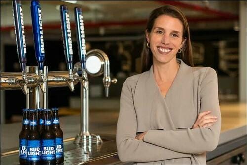 Alissa Heinerscheid in front of Bud Light taps. 