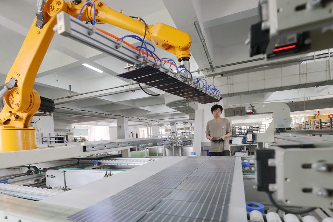 Workers at a photovoltaic panel production workshop in Huzhou, Zhejiang province produce a batch of solar panels for export in June, 2023. Photo: VCG