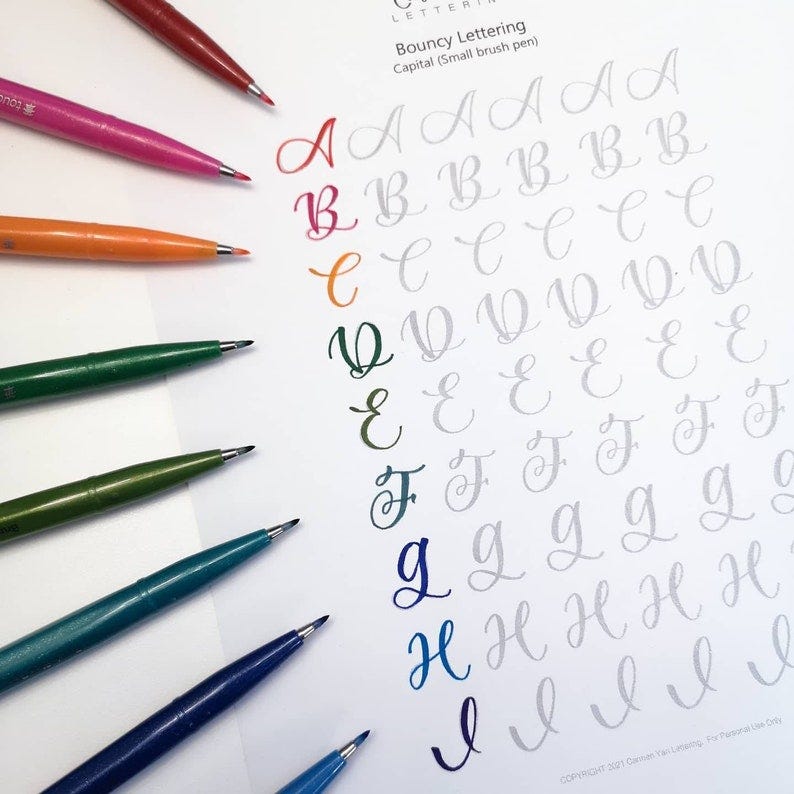 May include: A worksheet with the alphabet written in cursive with different colored markers next to each letter. The worksheet is titled "Bouncy Lettering" and "Capital (Small brush pen)".