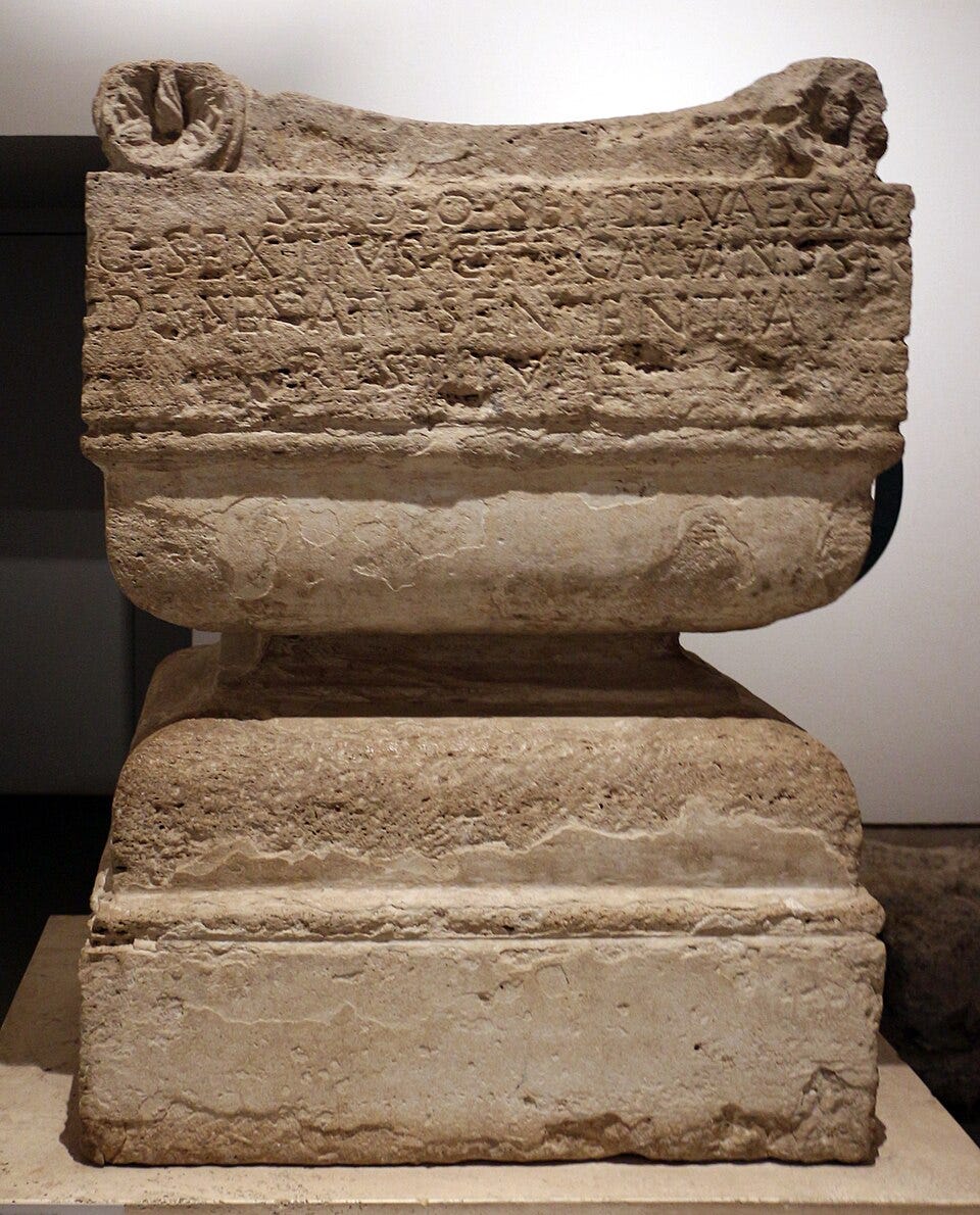 stone altar with Latin inscribed, which is translated below