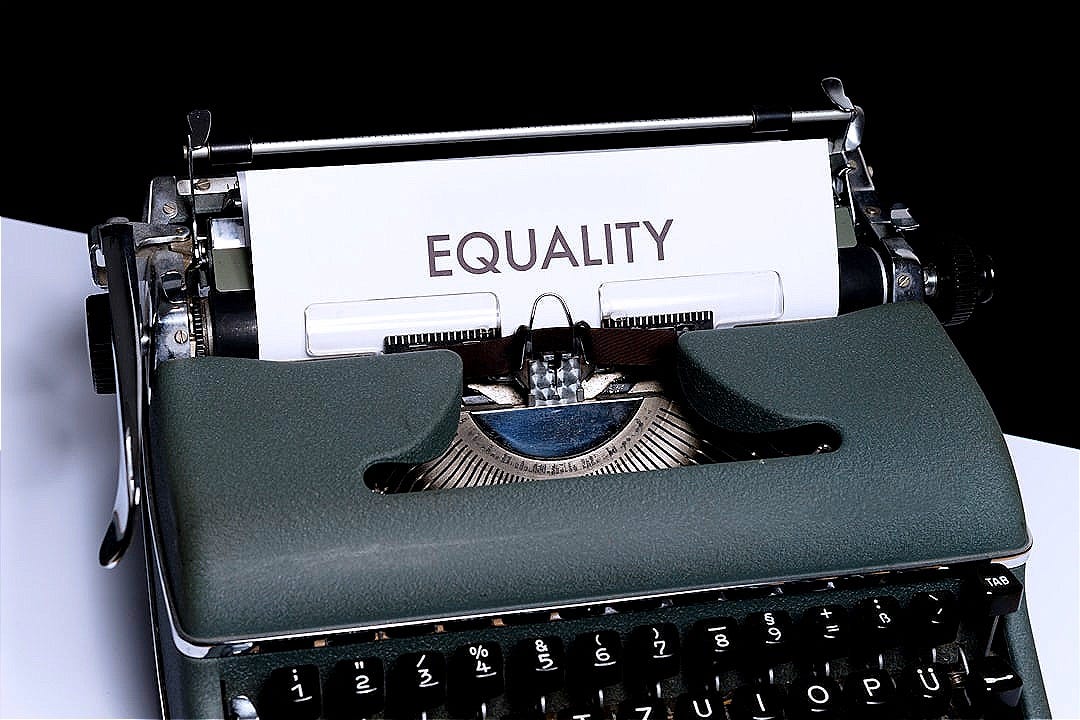 a typewriter with a paper that reads equality a typewriter with a paper that reads equality