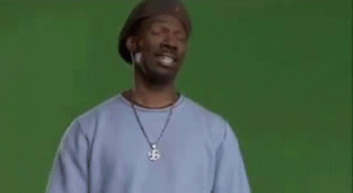 a man wearing a hat and a sweater with the word wrong on it .