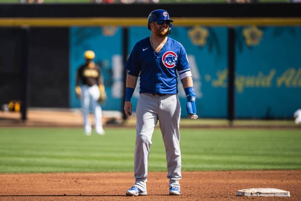 Justin Turner of the Chicago Cubs stands at seconds base during a spring training game against the San Diego Padres at Peoria Stadium on February 24,...