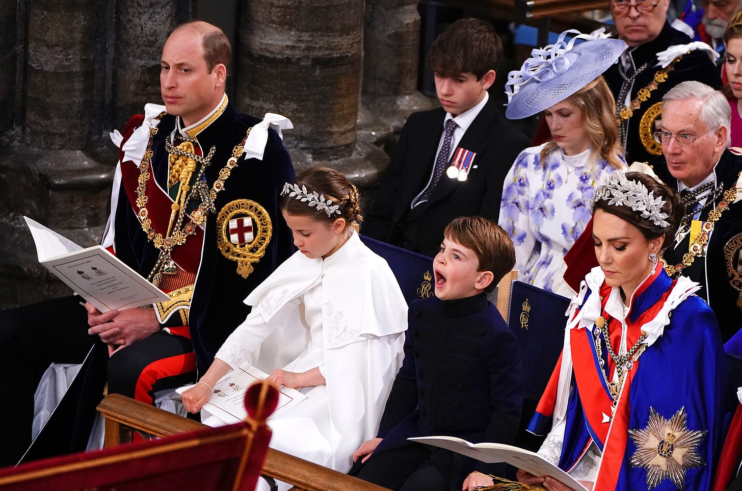prince louis looking bored at king and queen coronation