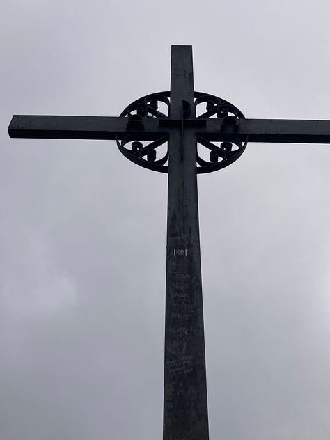 The Surrender--pics of gardens, flowers, cross, and archway