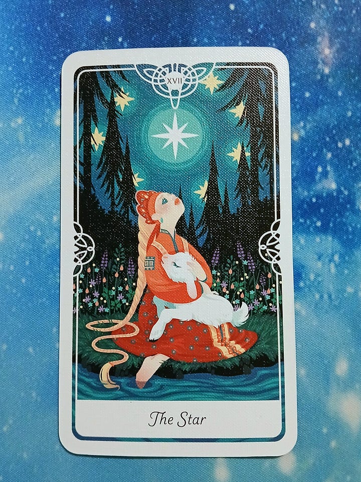 Tarot of the divine cards on a starry blue background