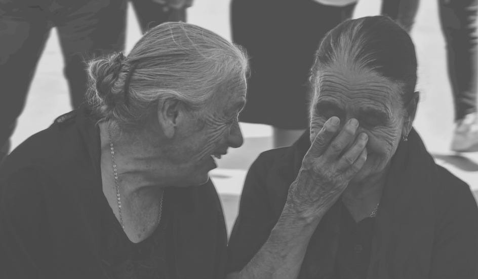 a black and white photo of a woman covering her face a black and white photo of a woman covering her face