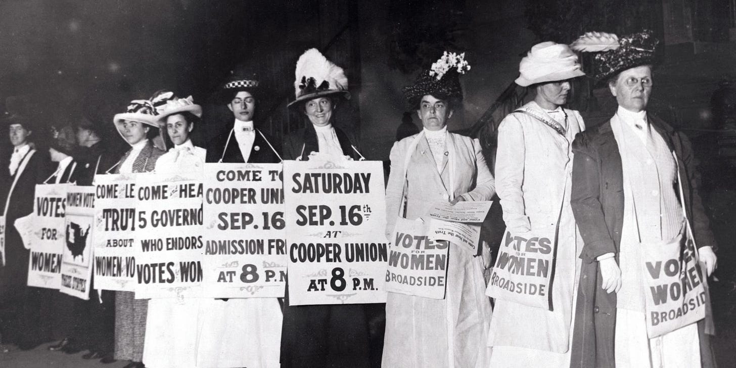 Suffragettes Marching with Signs(Original Caption) New York: New York Society Woman Suffragettes as sandwich men advertise a mass meeting to be addressed by the Governor of the Suffrage states. Photograph.