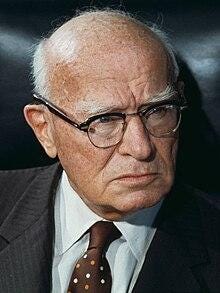 A person in a suit and tie

AI-generated content may be incorrect.