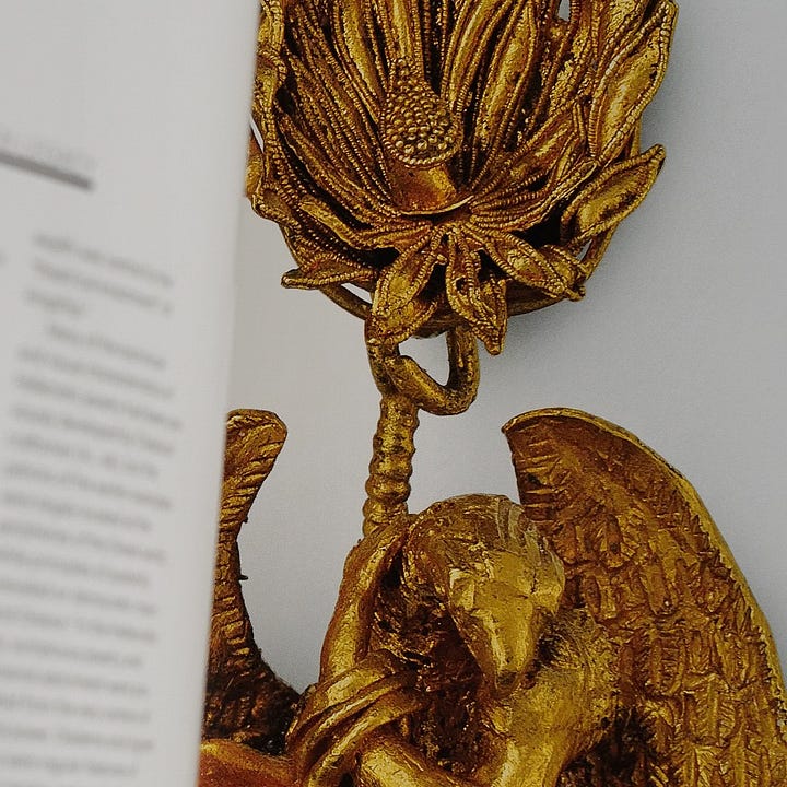 Two photos with cover and interior of the book on jewelry.