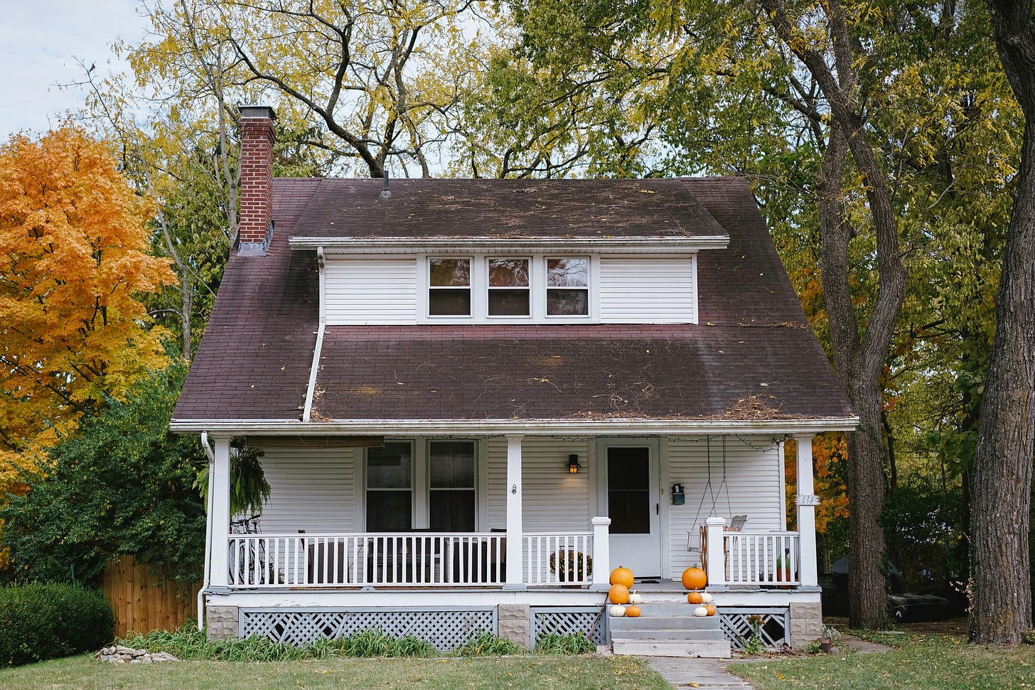 The front of a modest, single-family house. The front of a modest, single-family house.