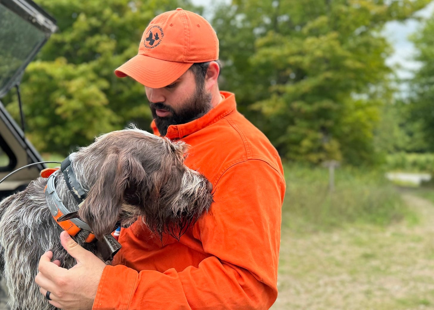 A hunter and a bird dog