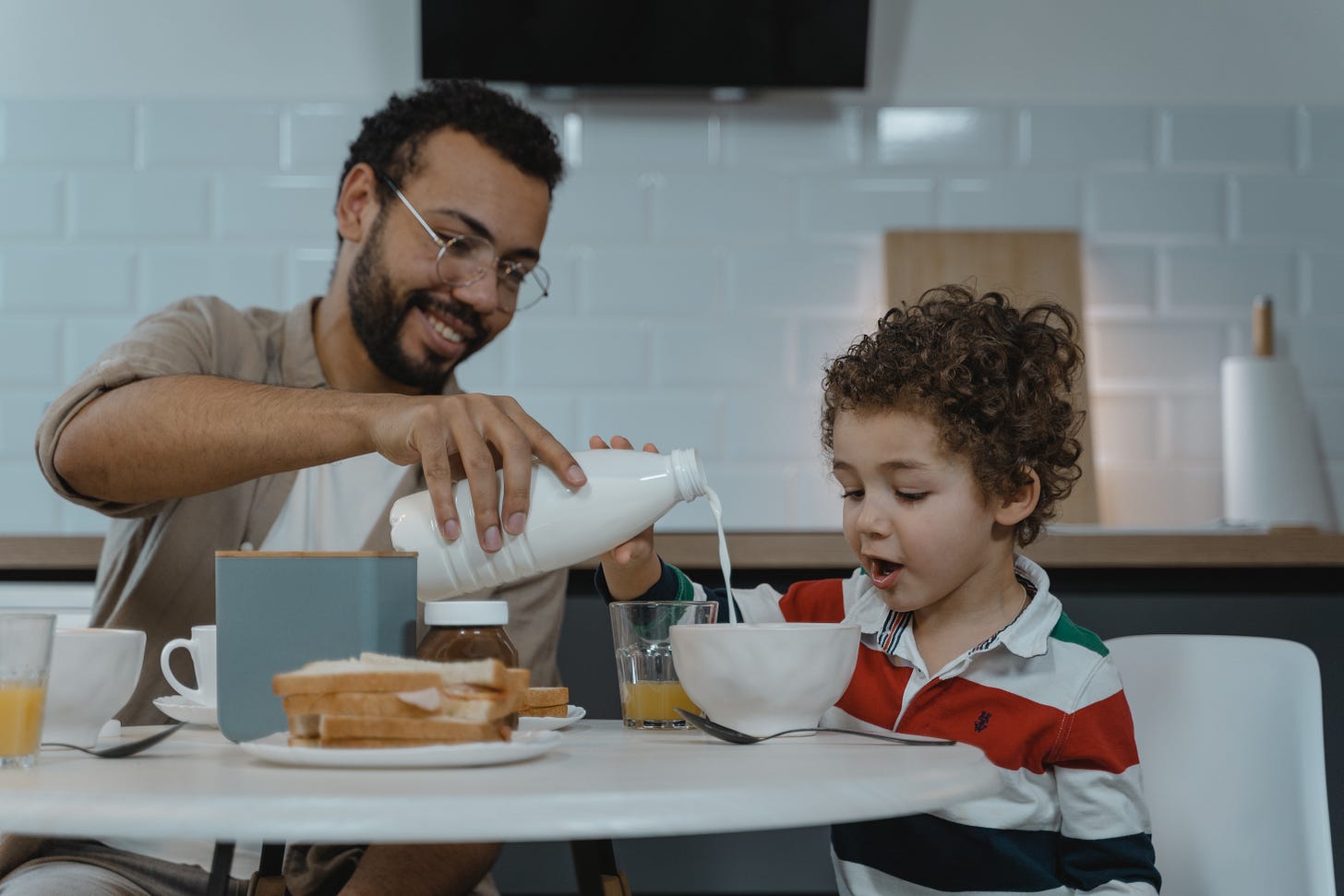 Dad and son having breakfast