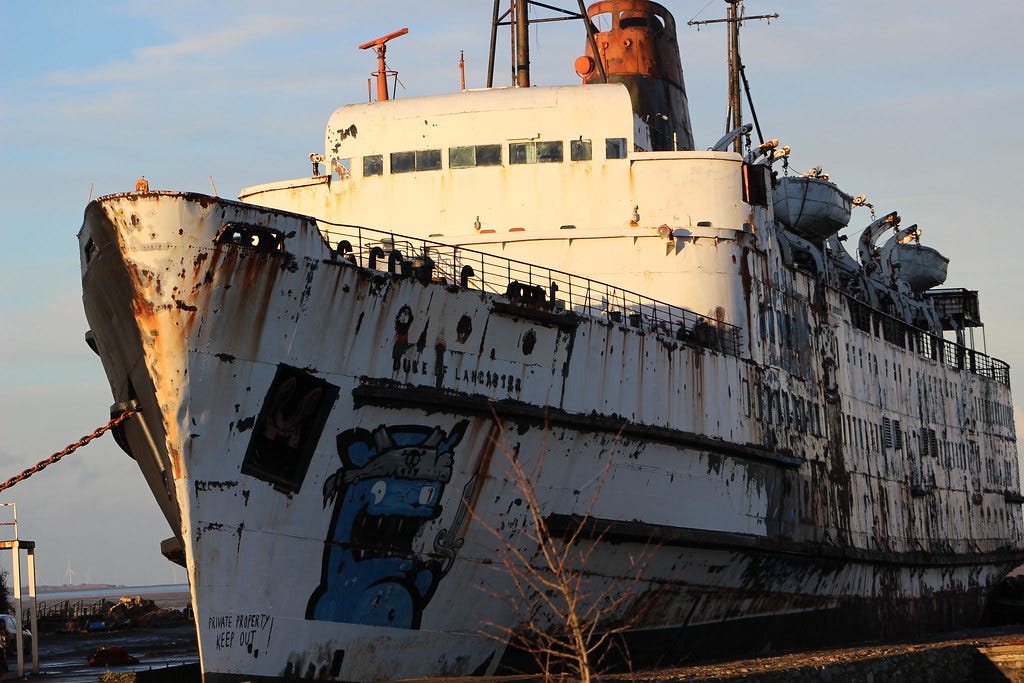 The rusting hull of the former Duke of Lancaster, later known as Mostyn Fun Ship“Mostyn Bay” by JamesRadleyTakesPhotos, CC BY-NC-ND 2.0 The rusting hull of the former Duke of Lancaster, later known as Mostyn Fun Ship“Mostyn Bay” by JamesRadleyTakesPhotos, CC BY-NC-ND 2.0