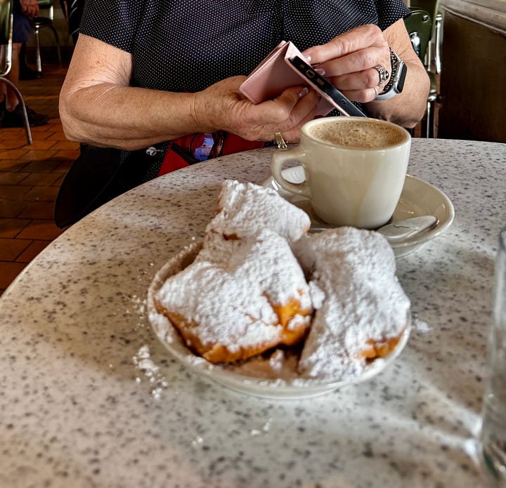 Scenes from New Orleans: Altar in St. Louis Cathedral; Kelvin the oyster shucker behind the bar at Crescent City Brewhouse; beignets at Cafe Du Monde; the Natchez sternwheeler at dock.