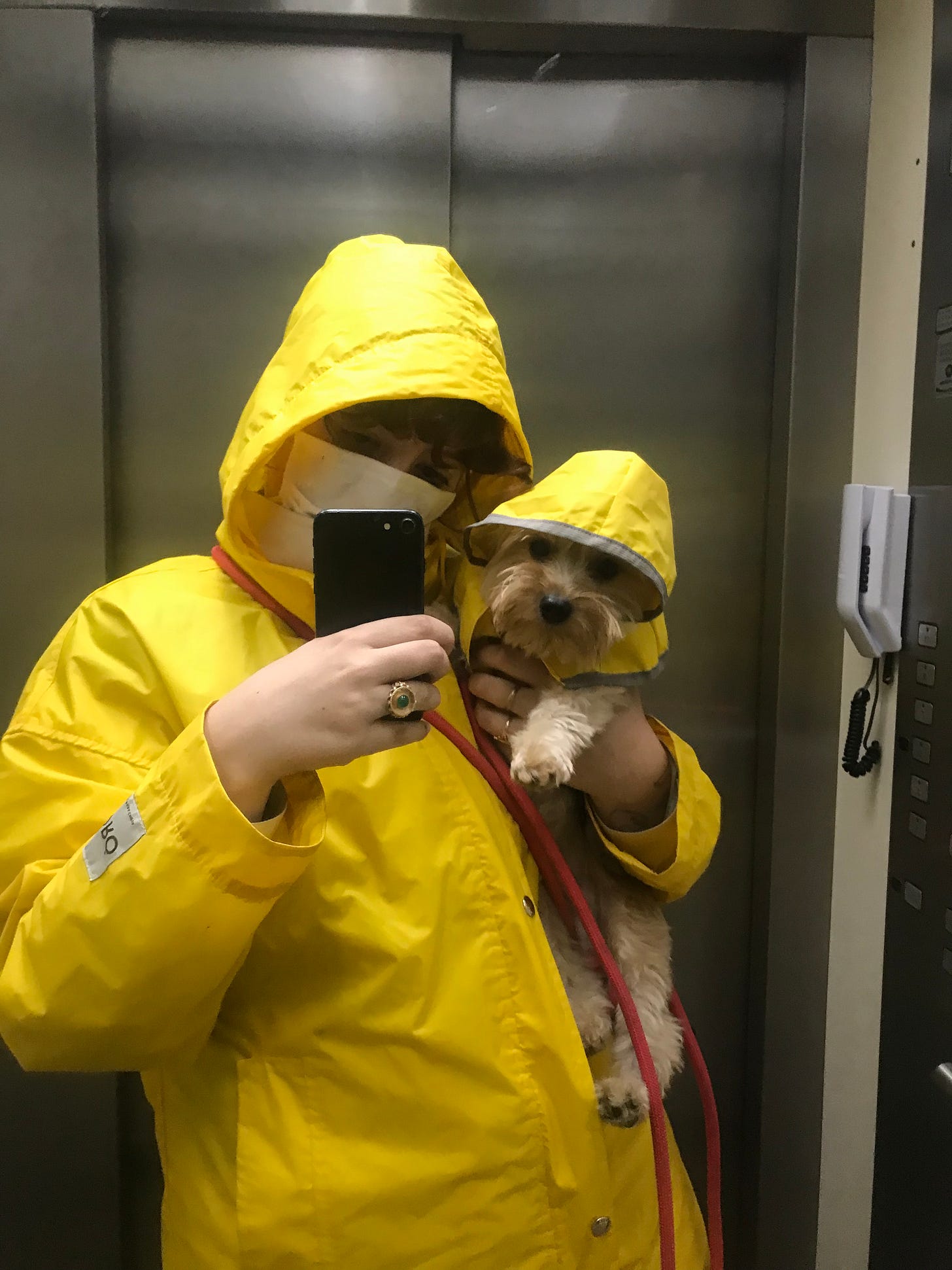 Larissa and Sagu in matching rain jackets.