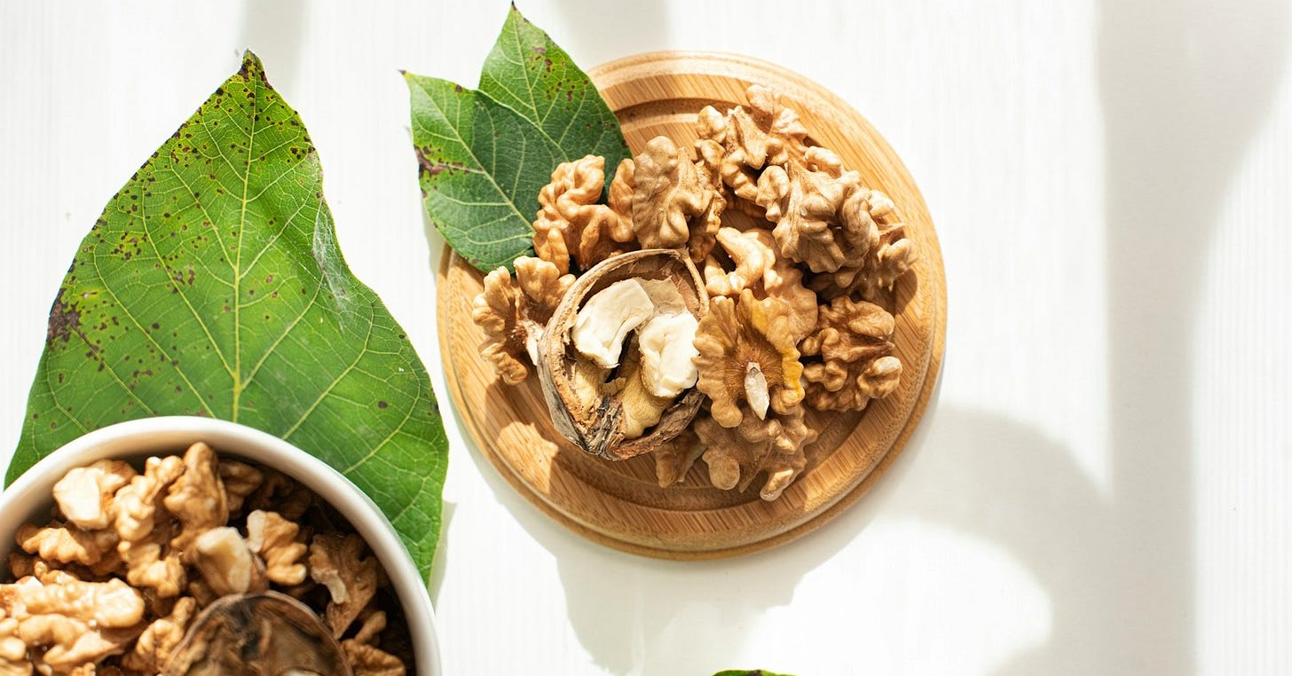 brown wooden bowl with brown nuts brown wooden bowl with brown nuts