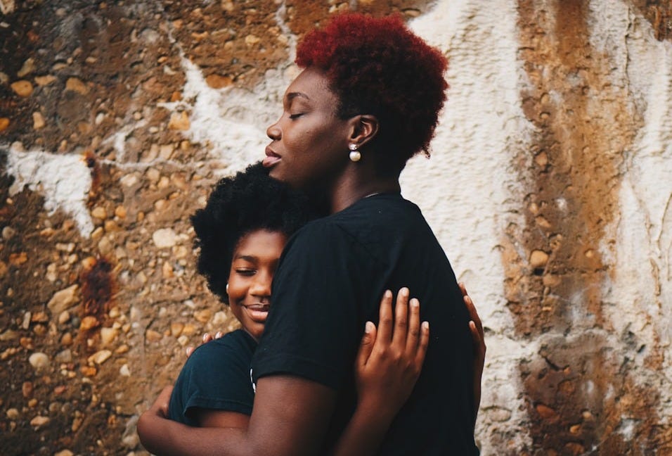two women hugging each other two women hugging each other