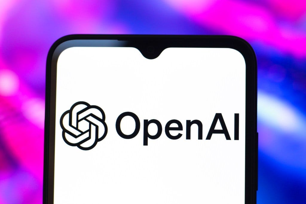 The OpenAI logo is seen displayed on a smartphone screen. The OpenAI logo is seen displayed on a smartphone screen.